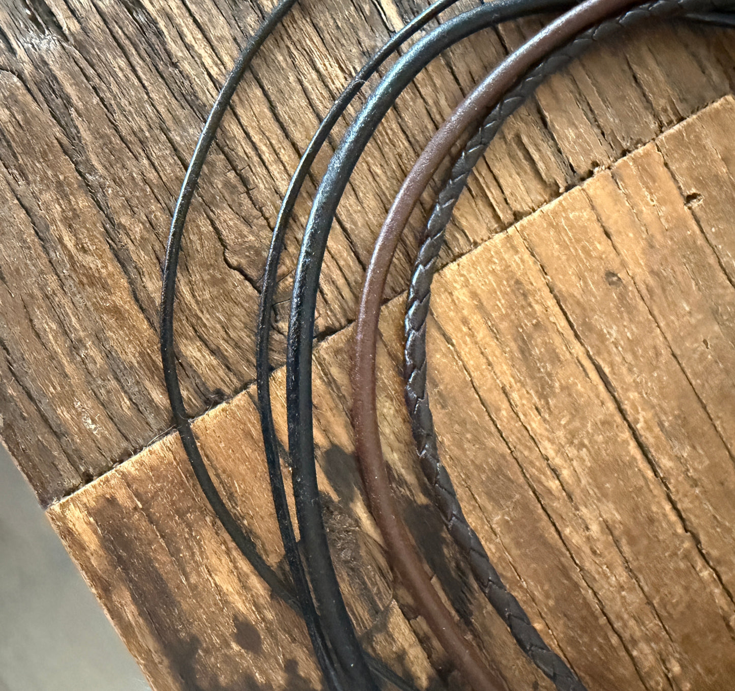 Leather cord chains with sterling silver clasps.